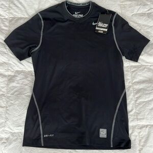New with tags, Nike Pro Combat, fitted compression shirt.